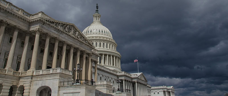Capitol storm Capitol dome below gray stormy skies